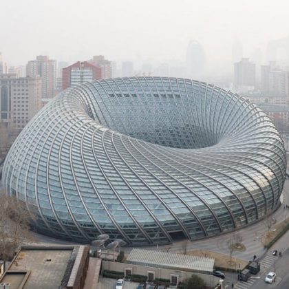 Doughnut-shaped television studio in Beijing is enclosed in a latticed shell