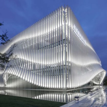 lacime architects cover exhibition hall with undulating facade in suzhou, china
