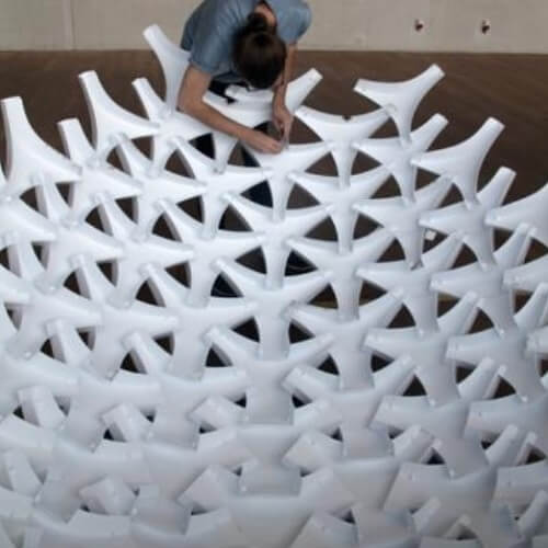 UNDULATUS: design and fabrication of a self-interlocking modular shell structure based on curved-line folding