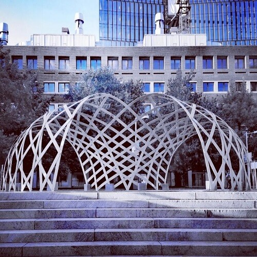 Inframe elastic timber gridshell